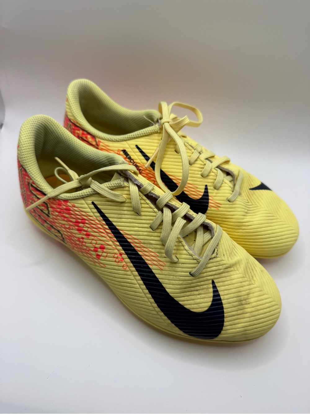Nike Mercurial Soccer cleats with Black Swoosh and Pink-Orange accents